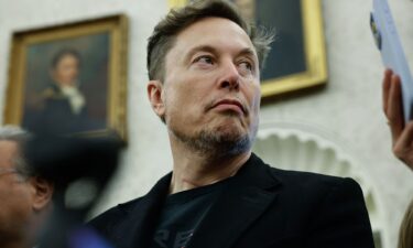 Elon Musk listens as reporters ask U.S. President Donald Trump and South Africa President Cyril Ramaphosa questions in the Oval Office.