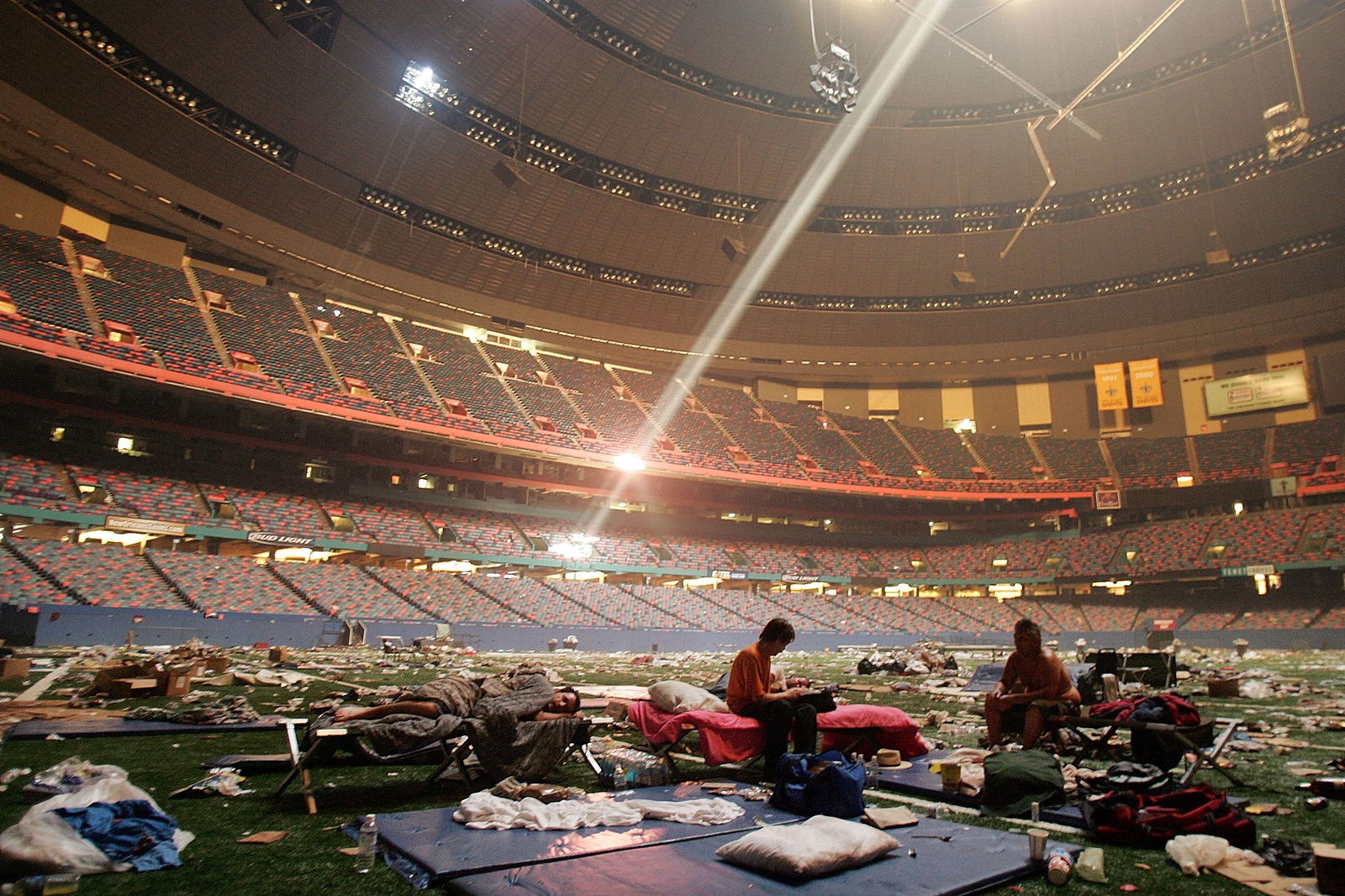 <i>Mario Tama/Getty Images/File via CNN Newsource</i><br/>Stranded victims of Hurricane Katrina rest inside the Superdome in New Orleans