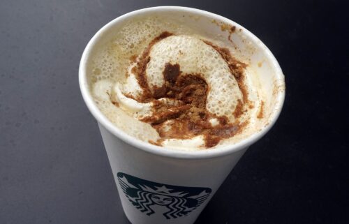 A Pumpkin Spice Latte drink rests on a table at a Starbucks in New York.