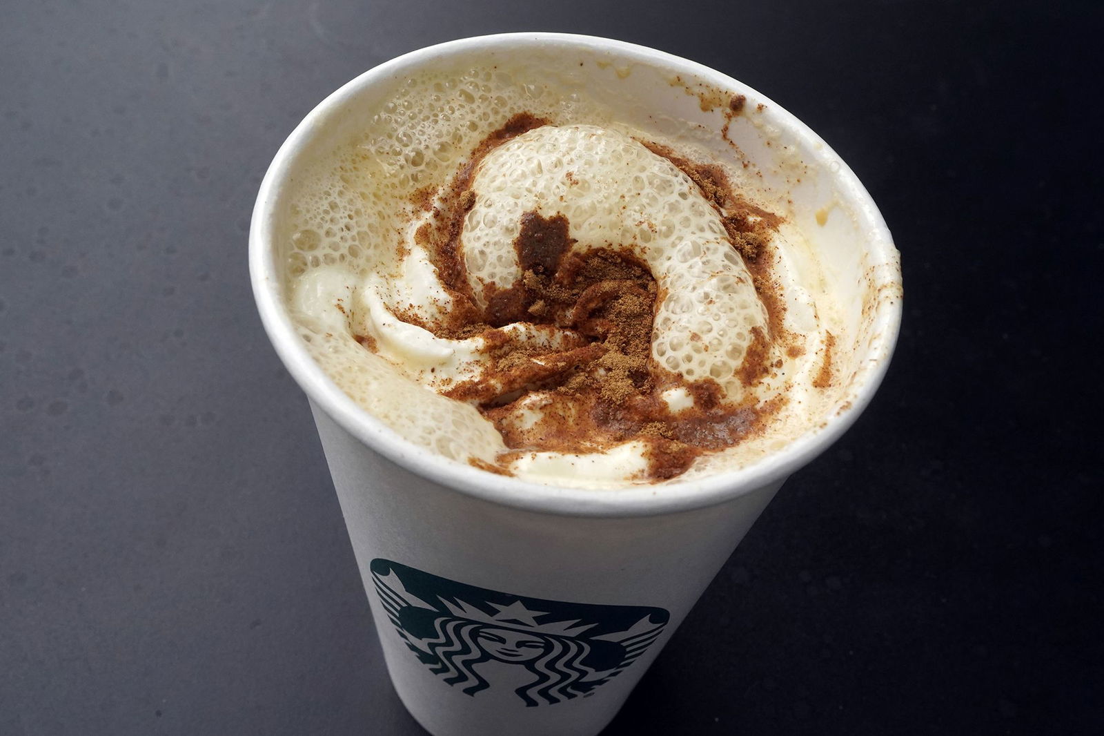 <i>Richard Drew/AP via CNN Newsource</i><br/>A Pumpkin Spice Latte drink rests on a table at a Starbucks in New York.