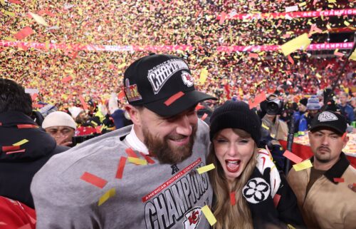 Taylor Swift celebrates with Travis Kelce #87 of the Kansas City Chiefs after defeating the Buffalo Bills 32-29 in the AFC Championship Game at GEHA Field at Arrowhead Stadium on January 26 in Kansas City