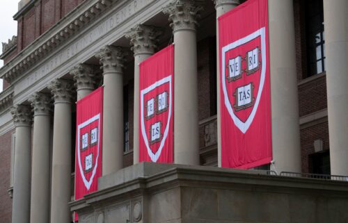 Harvard banners hang in front of Widener Library during the 374th Harvard Commencement in Harvard Yard in Cambridge