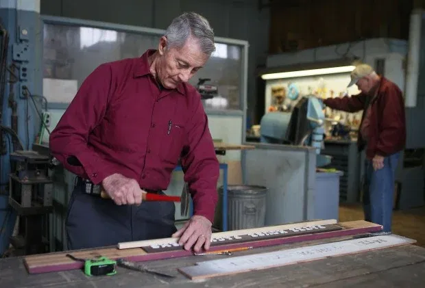 Gary Chilcote works on a sign at the Patee House museum in 2011. 