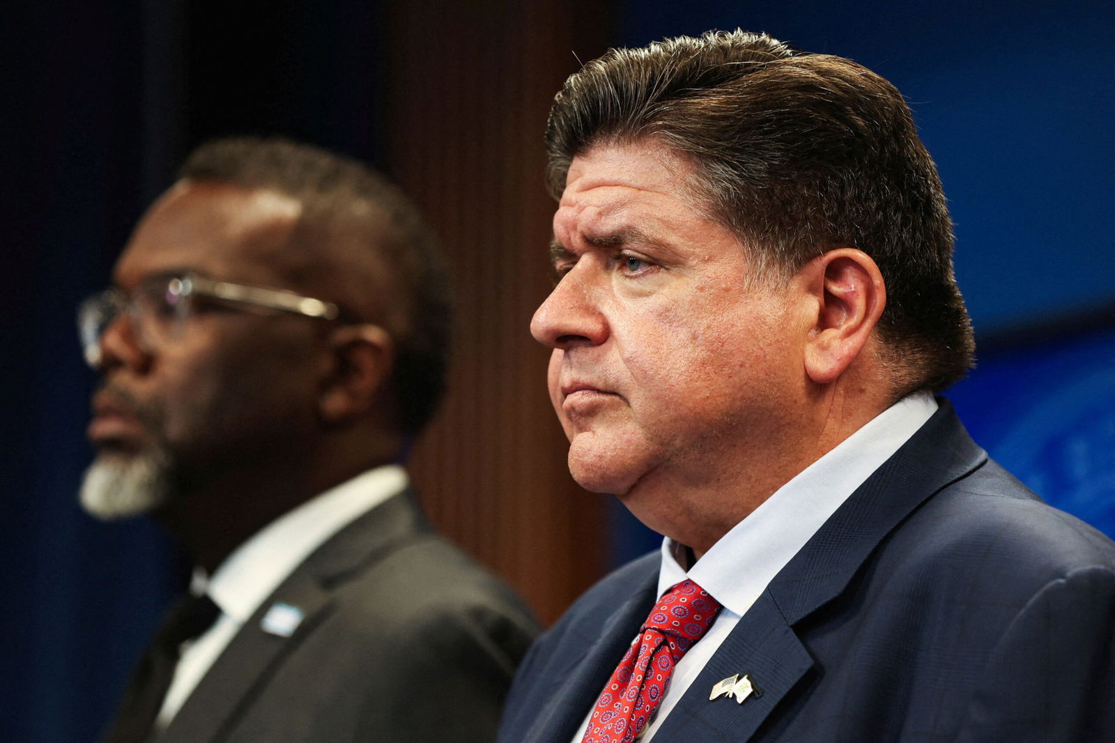 <i>Scott Olson/Getty Images via CNN Newsource</i><br/>Illinois Governor JB Pritzker speaks to the media onboard a water taxi passing Trump Tower about plans by President Donald Trump to send National Guard troops into Chicago on August 25.
