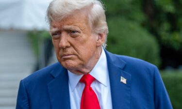 President Donald Trump talks to the media before boarding Marine One on the South Lawn of the White House on September 21.