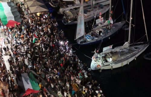 A screenshot from a drone video shows people gathering at a Greek port before the departure of two boats taking part in the Global Sumud Flotilla on September 14.