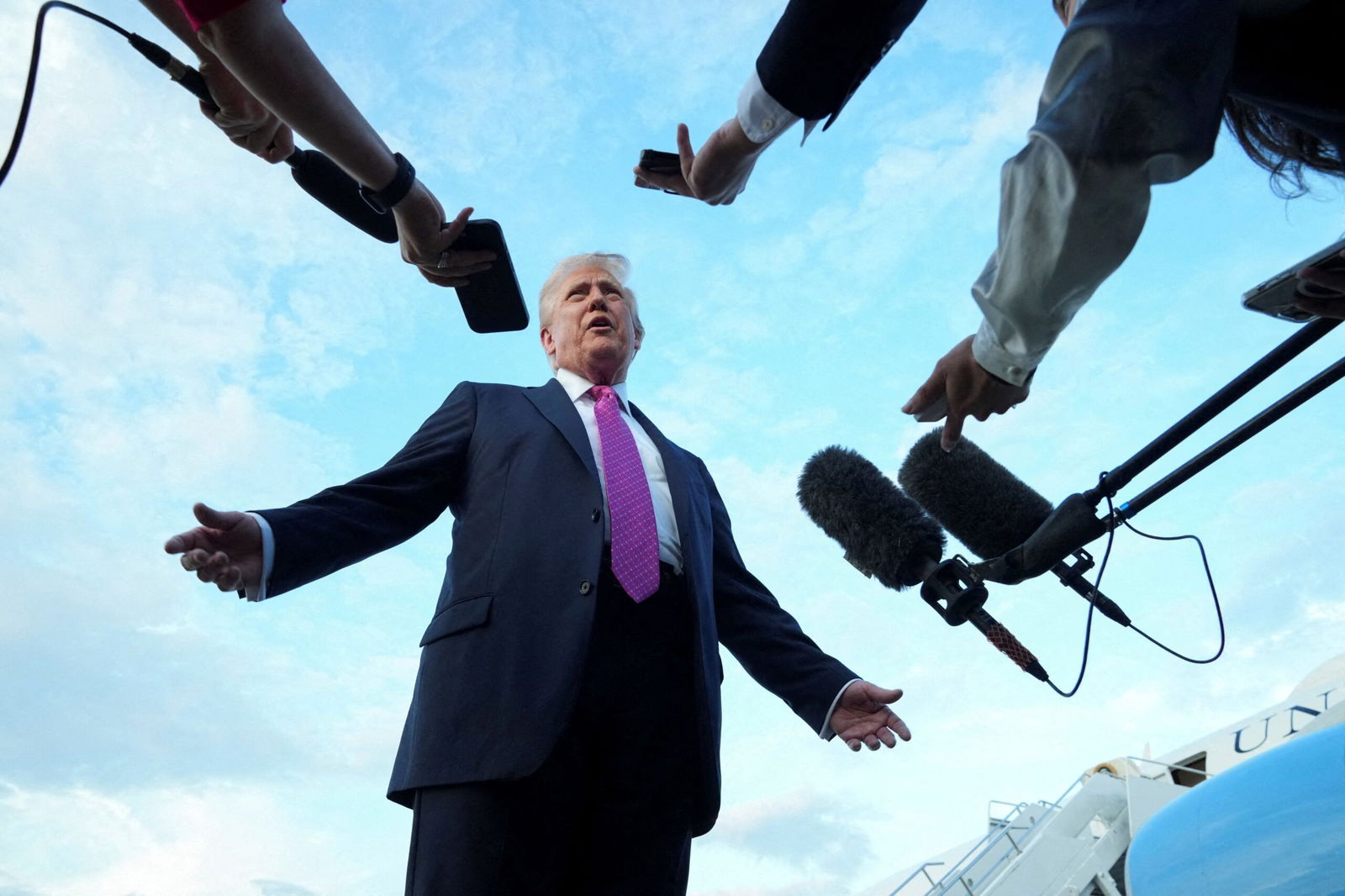 <i>Ken Cedeno/Reuters via CNN Newsource</i><br/>President Donald Trump speaks to the media before boarding Air Force One on September 14.