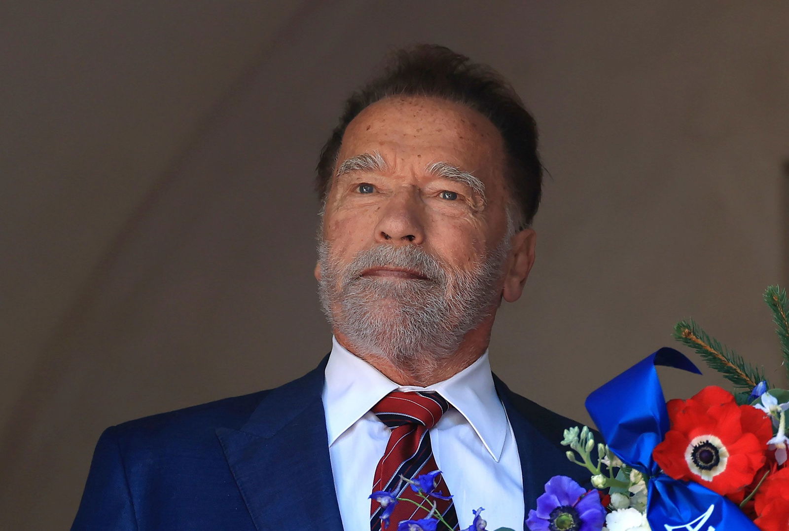 <i>mpi34/mediaPunch /IPX/AP via CNN Newsource</i><br/>Former California Gov. Arnold Schwarzenegger lays a wreath at George Washington's tomb during An American Celebration 2025 in Mount Vernon