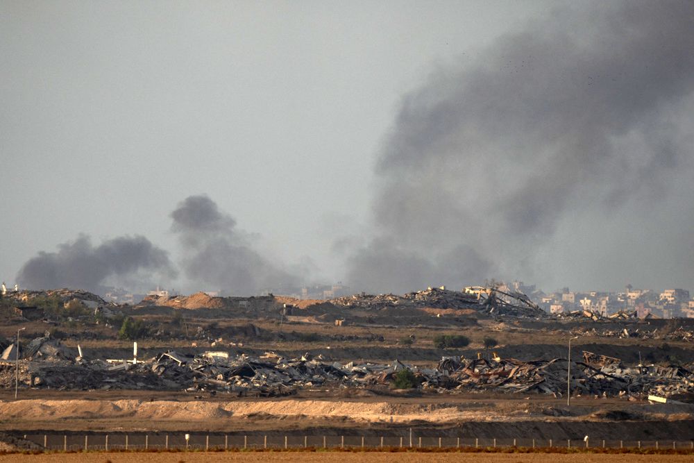 <i>Omar Al-Qattaa/AFP/Getty Images via CNN Newsource</i><br/>Displaced Palestinians transport their belongings on their fishing board as they flee Israeli bombardment southward