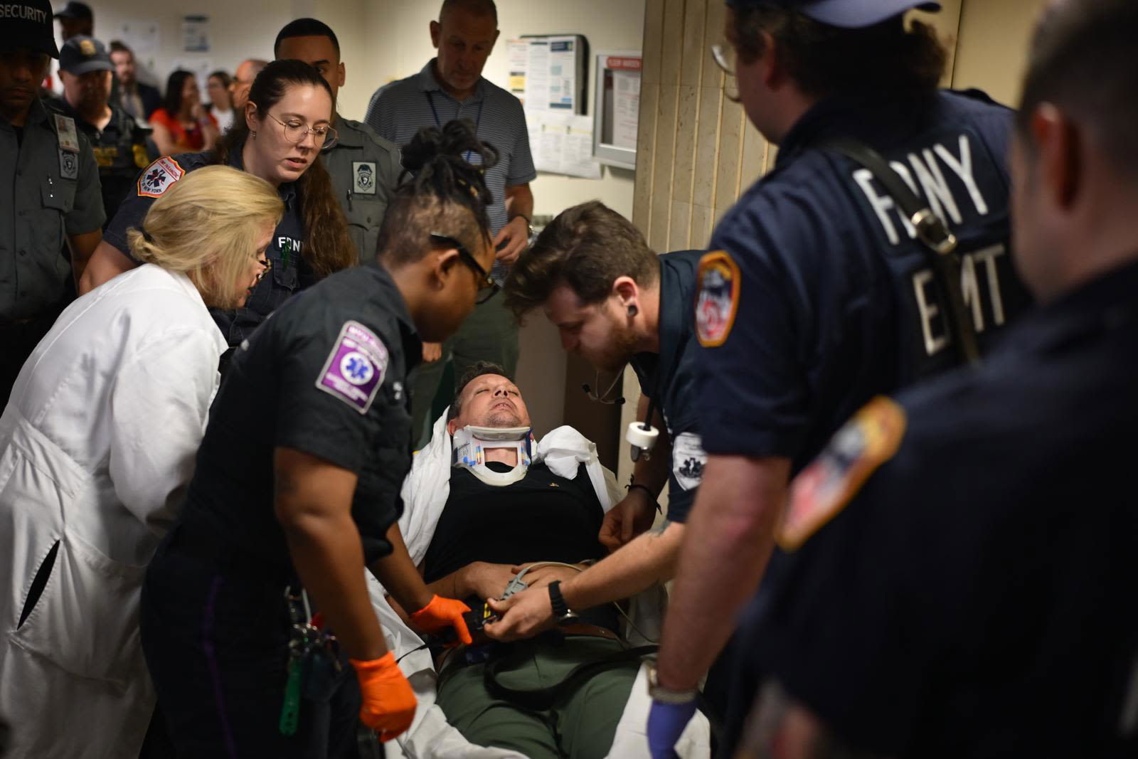 <i>Stephanie Keith/Getty Images via CNN Newsource</i><br/>A journalist is tended to after being thrown to the ground and injured by federal agents at a New York City immigration court on Tuesday.