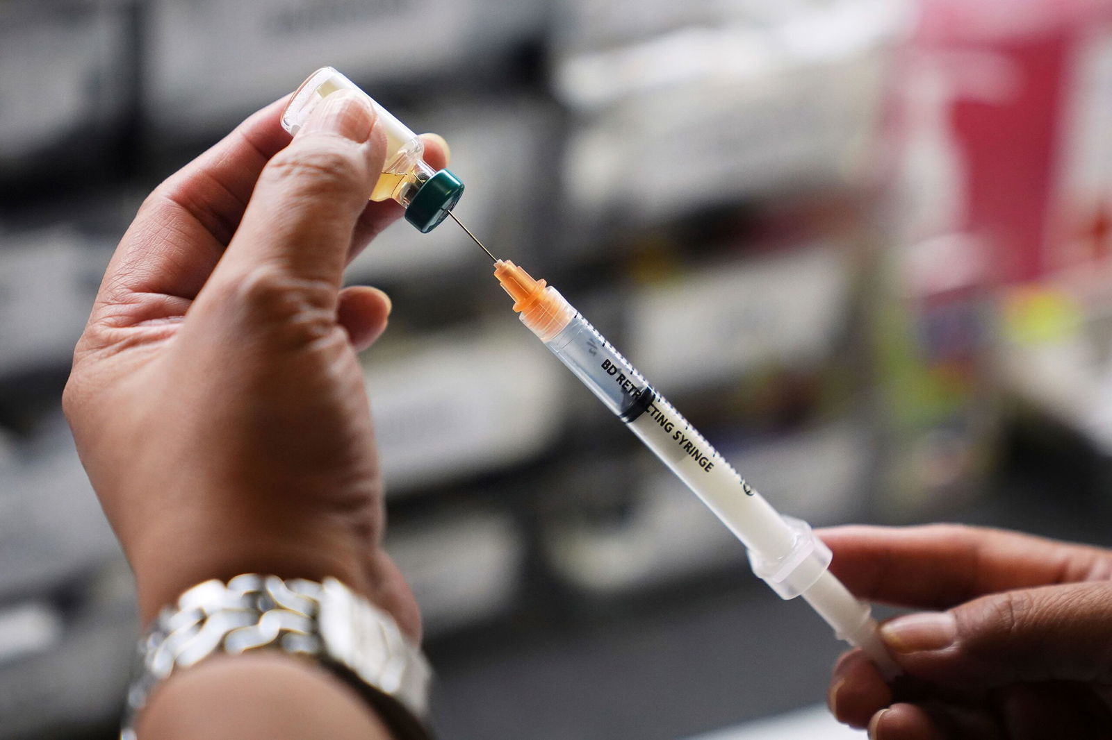 <i>Lindsey Wasson/AP via CNN Newsource</i><br/>A medical assistant prepares a dose of the measles