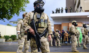 Federal agents clash with anti-ICE protesters at the US Immigration and Customs Enforcement building on October 12 in Portland