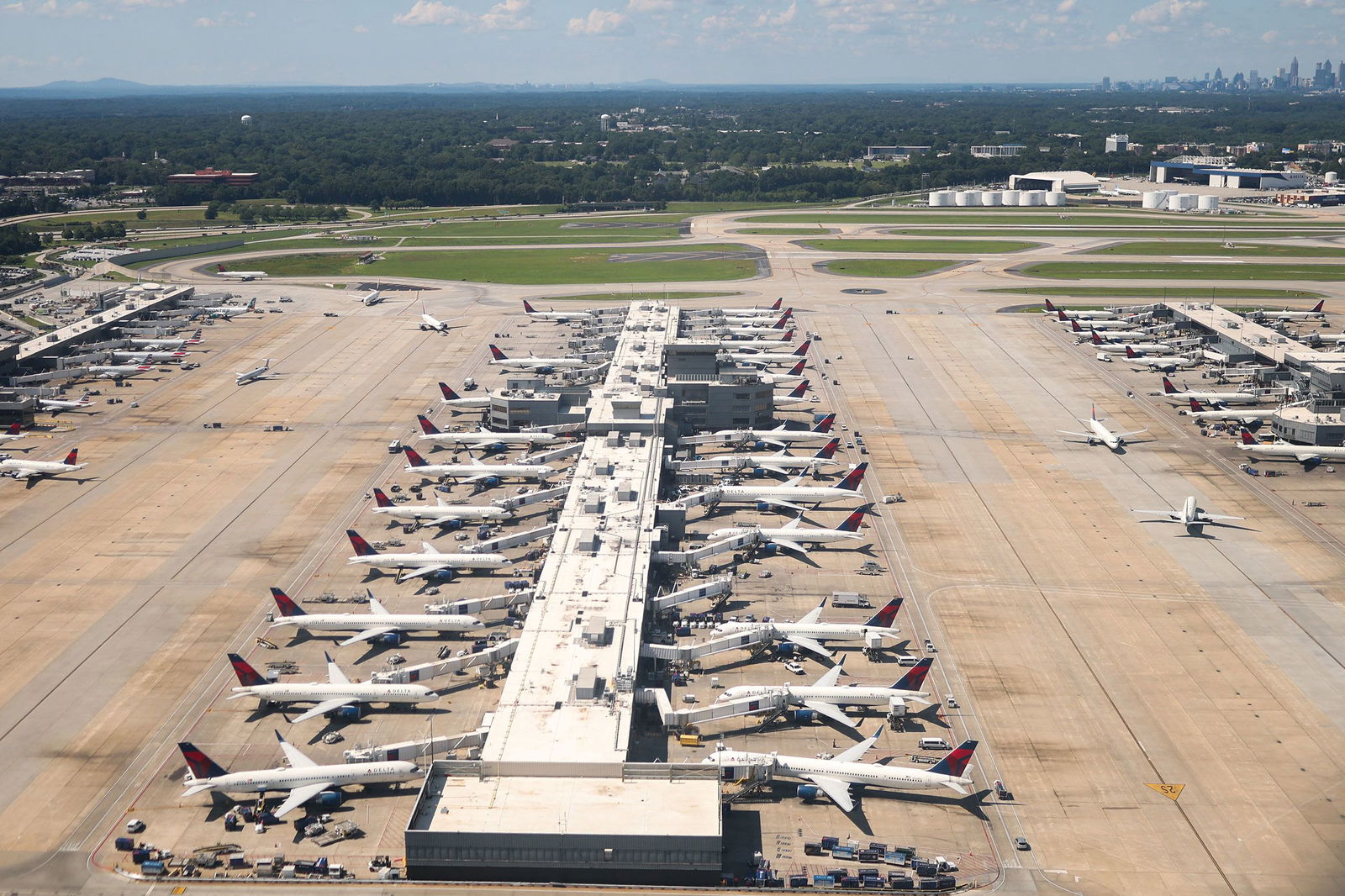 <i>Charly Triballeau/AFP/Getty Images/File via CNN Newsource</i><br/>Aircraft are seen at a terminal at Hartsfield-Jackson Atlanta International Airport in Atlanta on July 2.