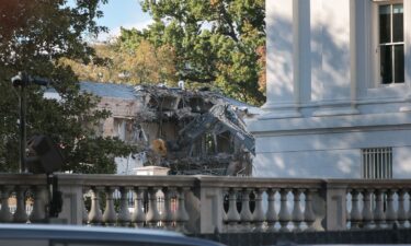 Workers demolish the facade of the East Wing of the White House on Monday