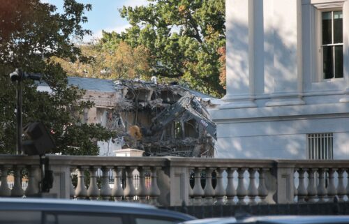 Workers demolish the facade of the East Wing of the White House on Monday