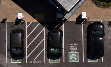 Electric cars sit parked at a charging station in California.