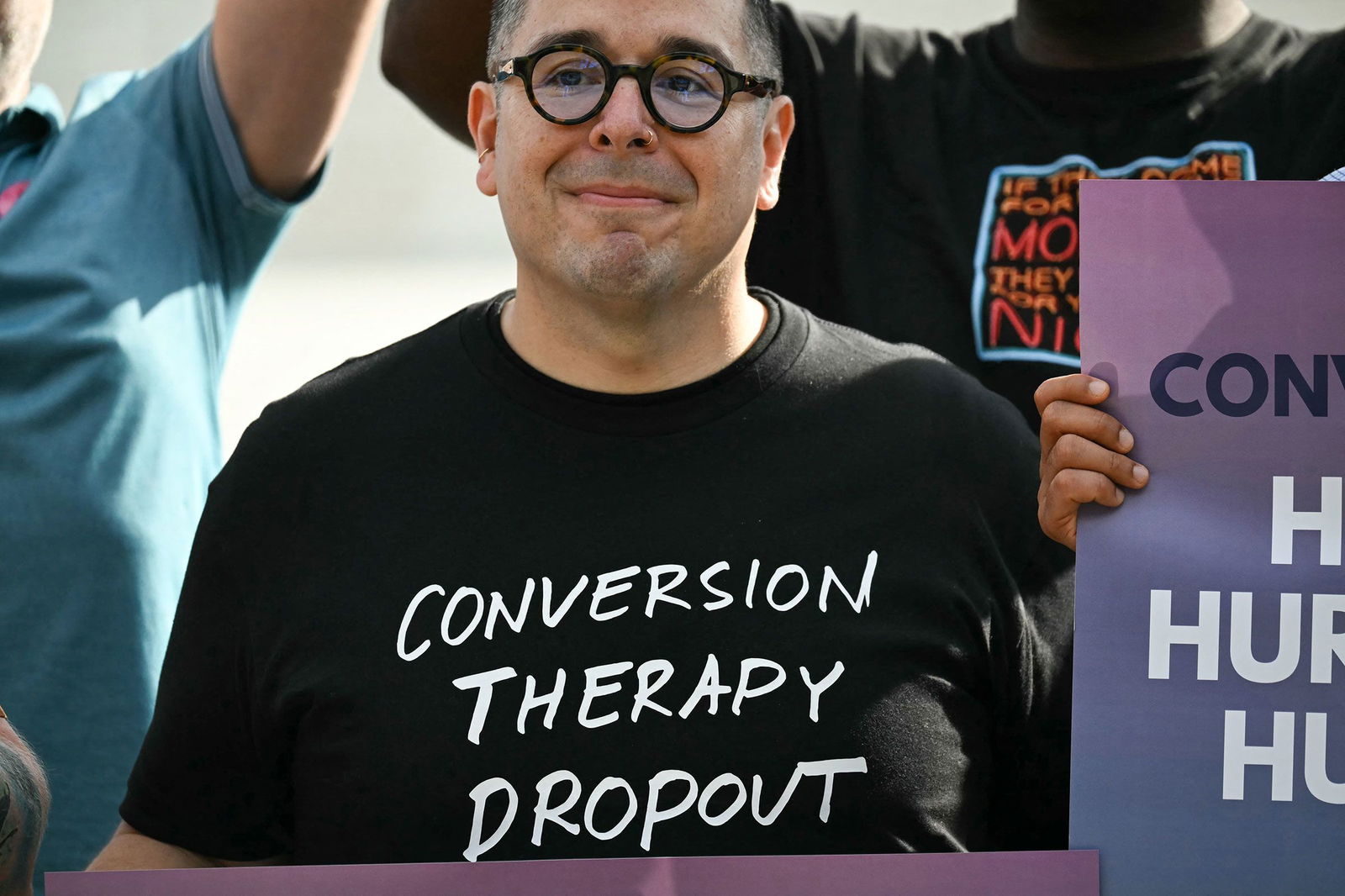 <i>Andrew Caballero-Reynolds/AFP/Getty Images via CNN Newsource</i><br/>A man wears a shirt reading 
