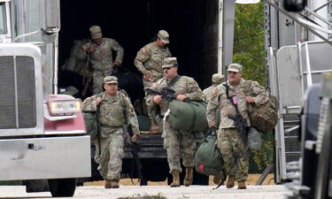 Military personnel in uniforms with the Texas National Guard patch are seen at the US Army Reserve Center in Elwood