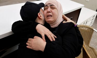 A freed Palestinian is hugged by a relative in Ramallah
