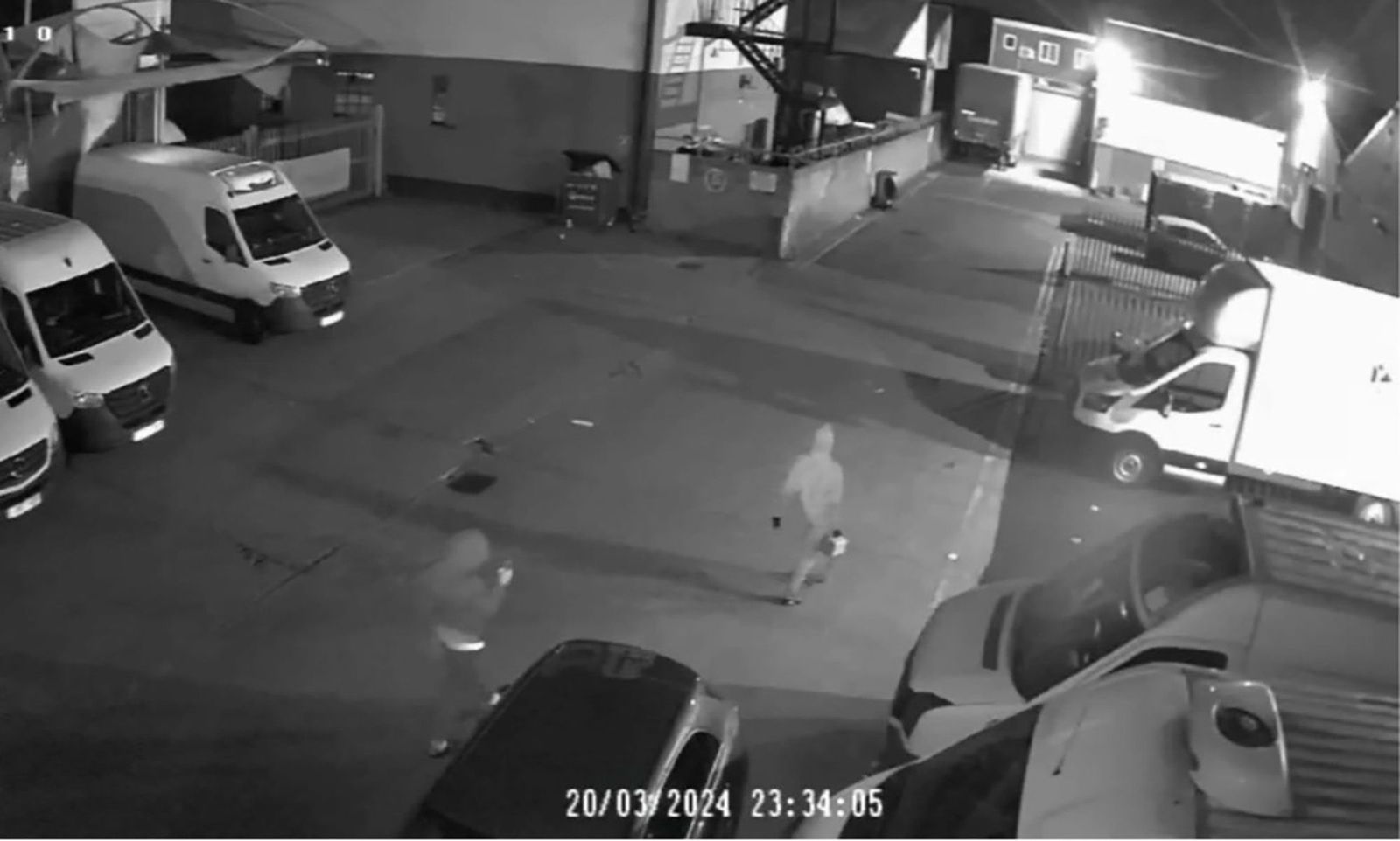<i>Crown Prosecution Service via CNN Newsource</i><br/>A still from security camera footage showed two men carrying a jerry can at the industrial estate in London.