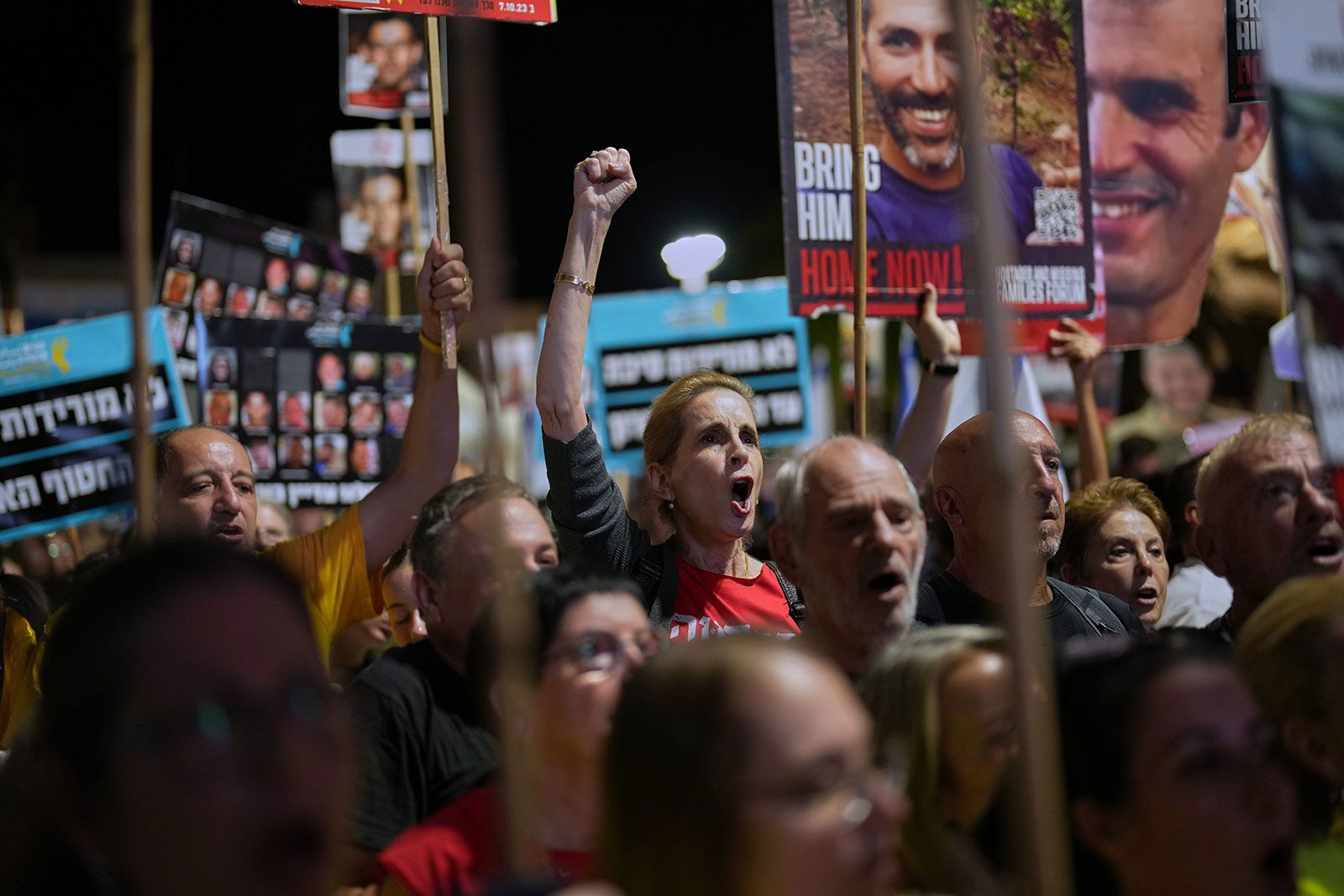 <i>Francisco Seco/AP/File via CNN Newsource</i><br/>People take part in a rally at Tel Aviv's
