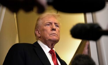 President Donald Trump speaks to reporters aboard Air Force One on Sunday