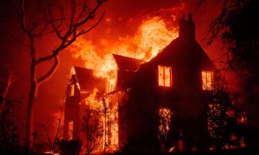 A home burns during the Eaton fire in the Altadena area of Los Angeles County