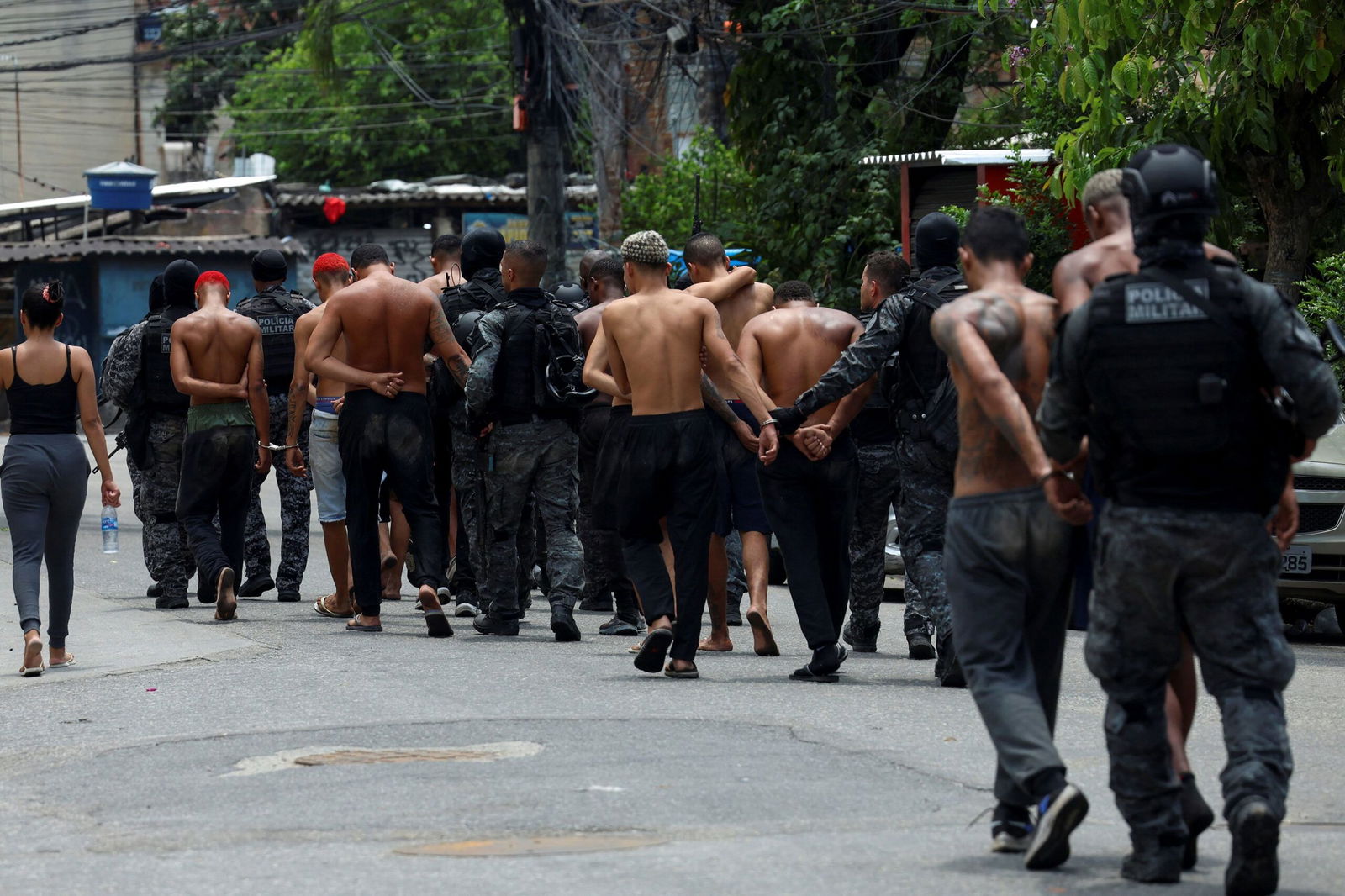 <i>Aline Massuca/Reuters via CNN Newsource</i><br/>Members of the military police special unit detain suspected drug dealers during a police operation against drug trafficking in Rio de Janeiro