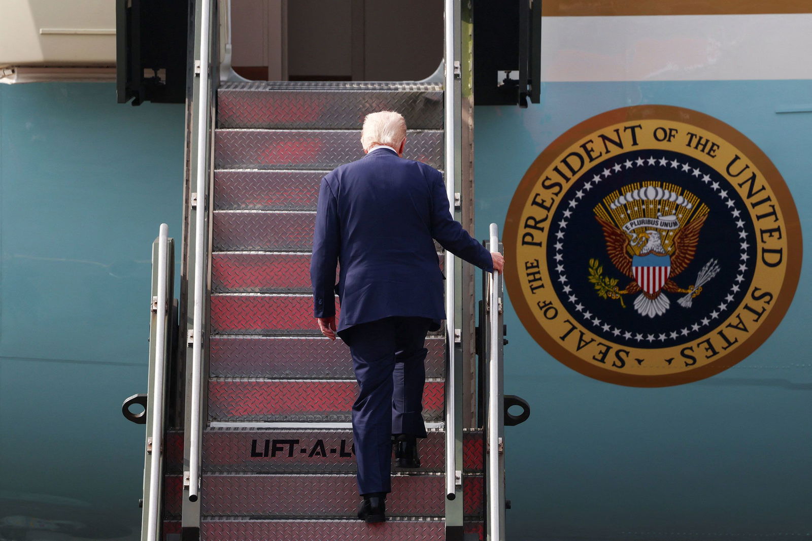 <i>Evelyn Hockstein/Reuters via CNN Newsource</i><br/>President Donald Trump boards Air Force One at Gimhae International Airport in Busan