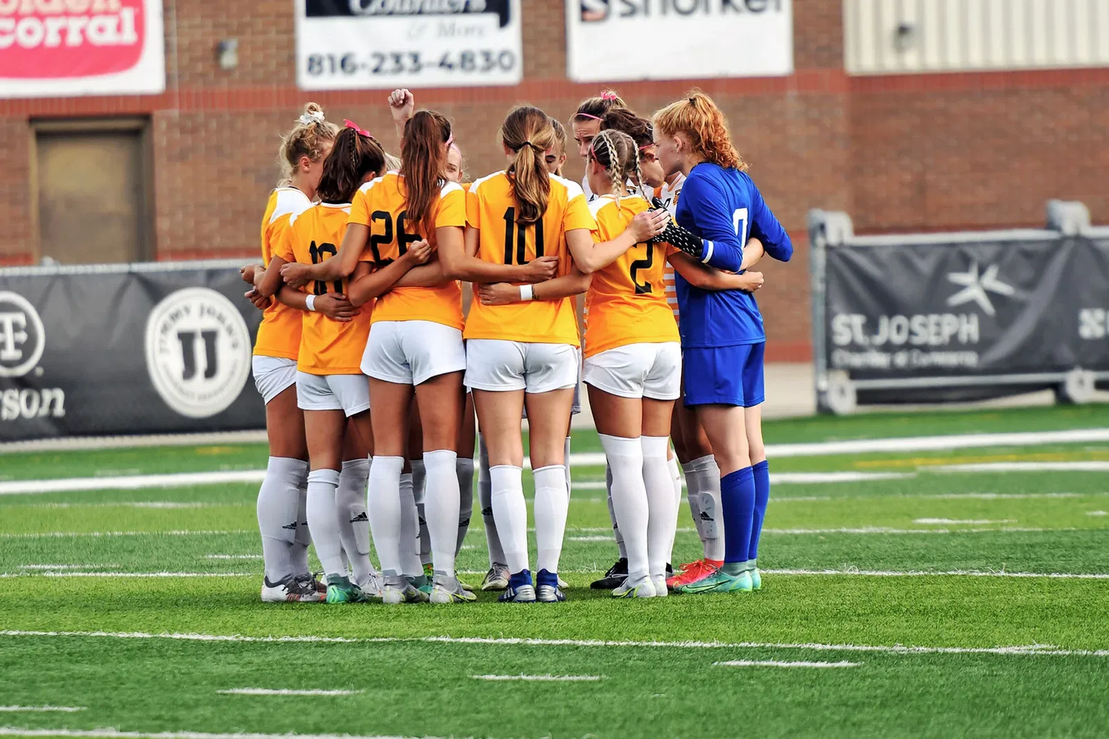 The Missouri Western soccer team huddles prior to a game in 2021. 