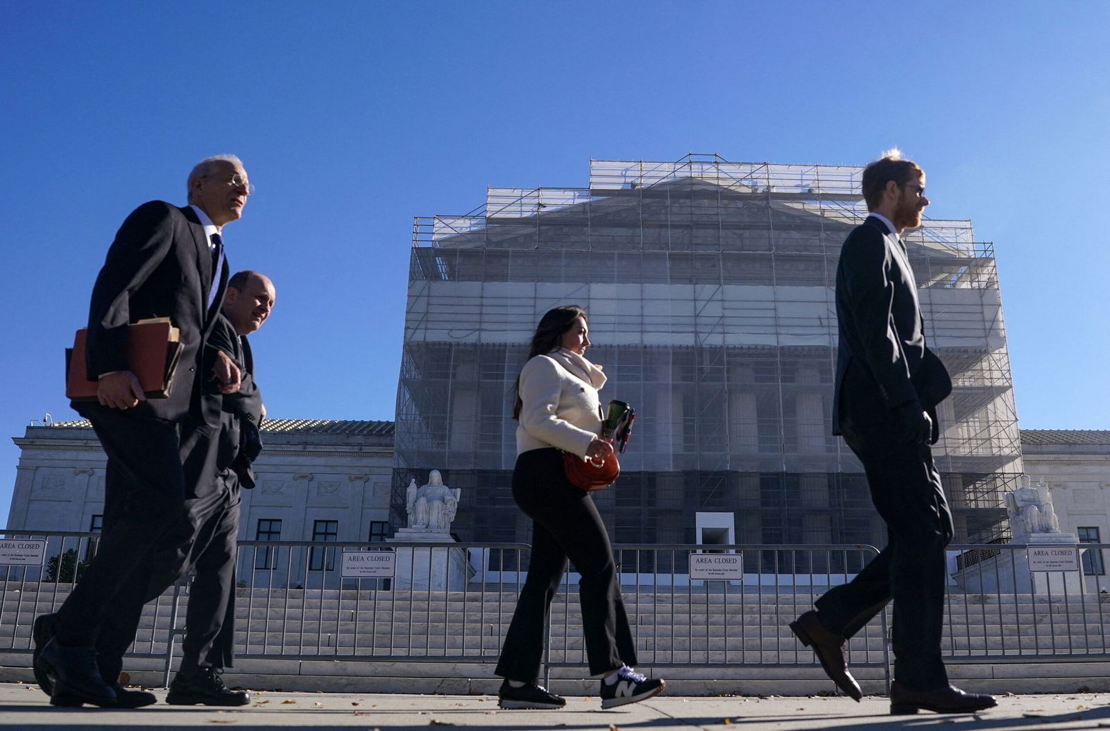 <i>Nathan Howard/Reuters via CNN Newsource</i><br/>Members of the public walk outside the U.S. Supreme Court to attend oral arguments on U.S. President Donald Trump's bid to preserve sweeping tariffs after lower courts ruled that Trump overstepped his authority