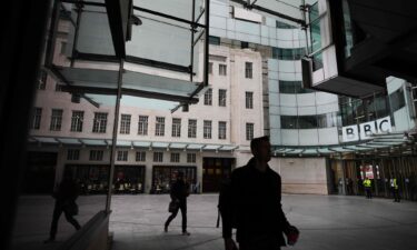 Pedestrians walk outside BBC Broadcasting House in London