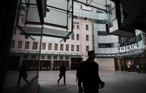 Pedestrians walk outside BBC Broadcasting House in London