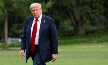 President Donald Trump walks on the South Lawn of the White House on July 13