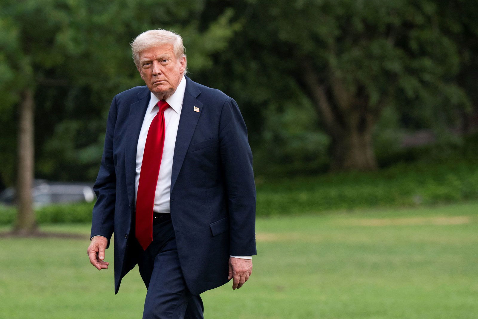 <i>Annabelle Gordon/Reuters via CNN Newsource</i><br/>President Donald Trump walks on the South Lawn of the White House on July 13