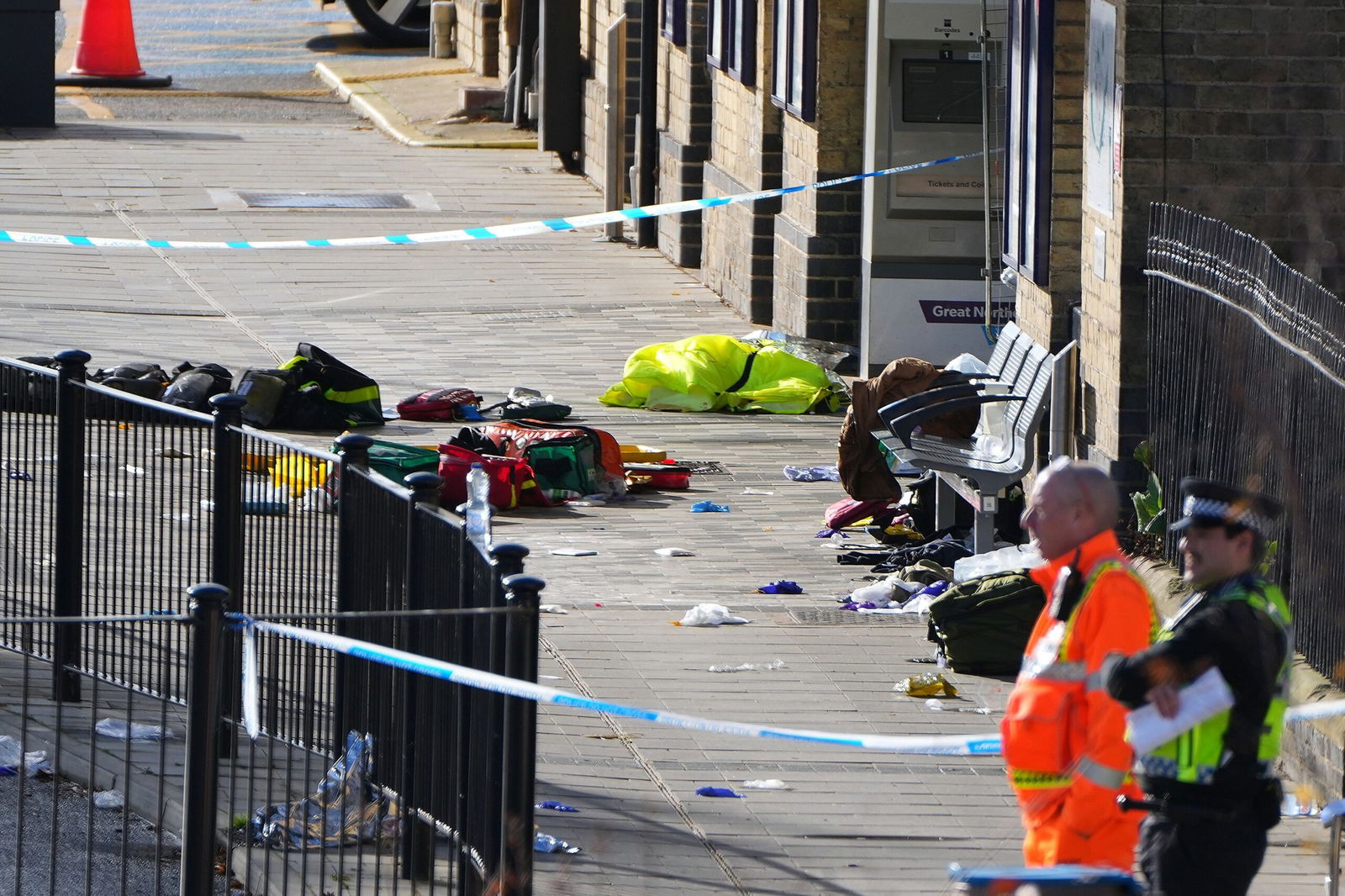 <i>Kirsty Wigglesworth/AP via CNN Newsource</i><br/>Belongings of passengers are seen on the ground at the entrance to Huntingdon train station after a mass stabbing on a London-bound train.