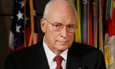 Vice President Dick Cheney listens as President George W. Bush