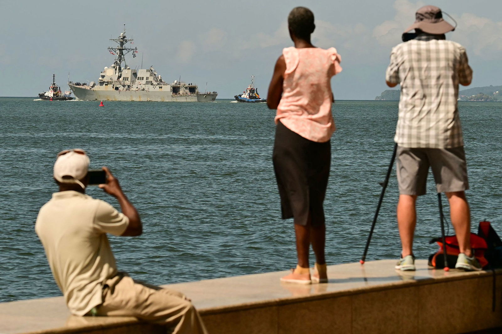 <i>Martin Bernetti/AFP/Getty Images via CNN Newsource</i><br/>People watch the USS Gravely depart the Port of Spain in Trinidad and Tobago on October 30. The warship arrived in Trinidad and Tobago on October 26