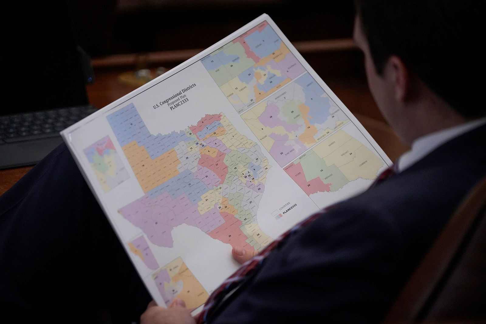 <i>Jay Janner/The Austin American-Statesman/Getty Images via CNN Newsource</i><br/>A representative looks at a congressional redistricting map during debate of a congressional redistricting plan in the House Chamber at the Texas State Capitol in Austin