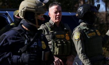 Top Border Patrol official Greg Bovino looks on during an immigration raid in Charlotte