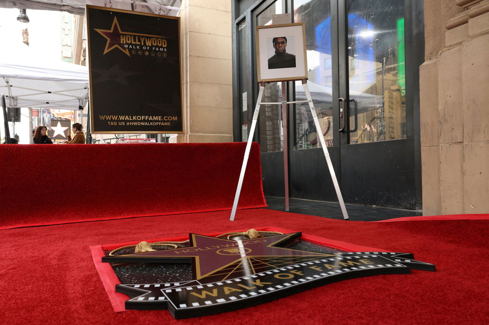 <i>Mario Anzuoni/Reuters via CNN Newsource</i><br/>A photo of late actor Chadwick Boseman is set on an easel ahead of the unveiling of his star on the Hollywood Walk of Fame in Los Angeles on Thursday.