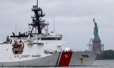 A Coast Guard ship sails past the Statue of Liberty on May 21 in New York City.