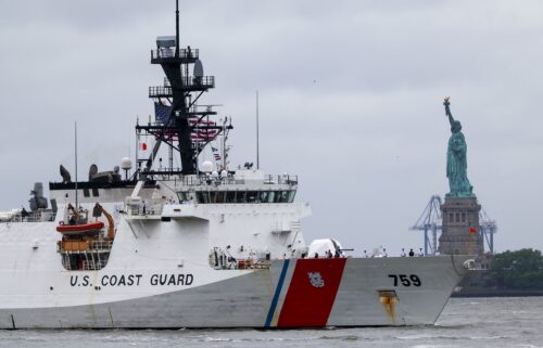 A Coast Guard ship sails past the Statue of Liberty on May 21 in New York City.