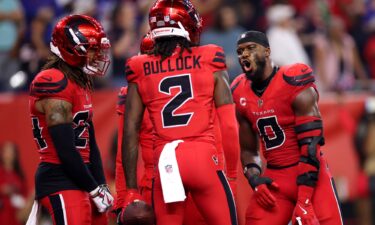 Houston Texans defenders Azeez Al-Shaair (#0) and Calen Bullock (#2) celebrate in the fourth quarter against the Buffalo Bills on November 20.