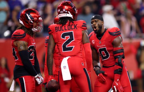 Houston Texans defenders Azeez Al-Shaair (#0) and Calen Bullock (#2) celebrate in the fourth quarter against the Buffalo Bills on November 20.