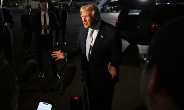 President Donald Trump speaks to reporters before boarding Air Force One on November 16