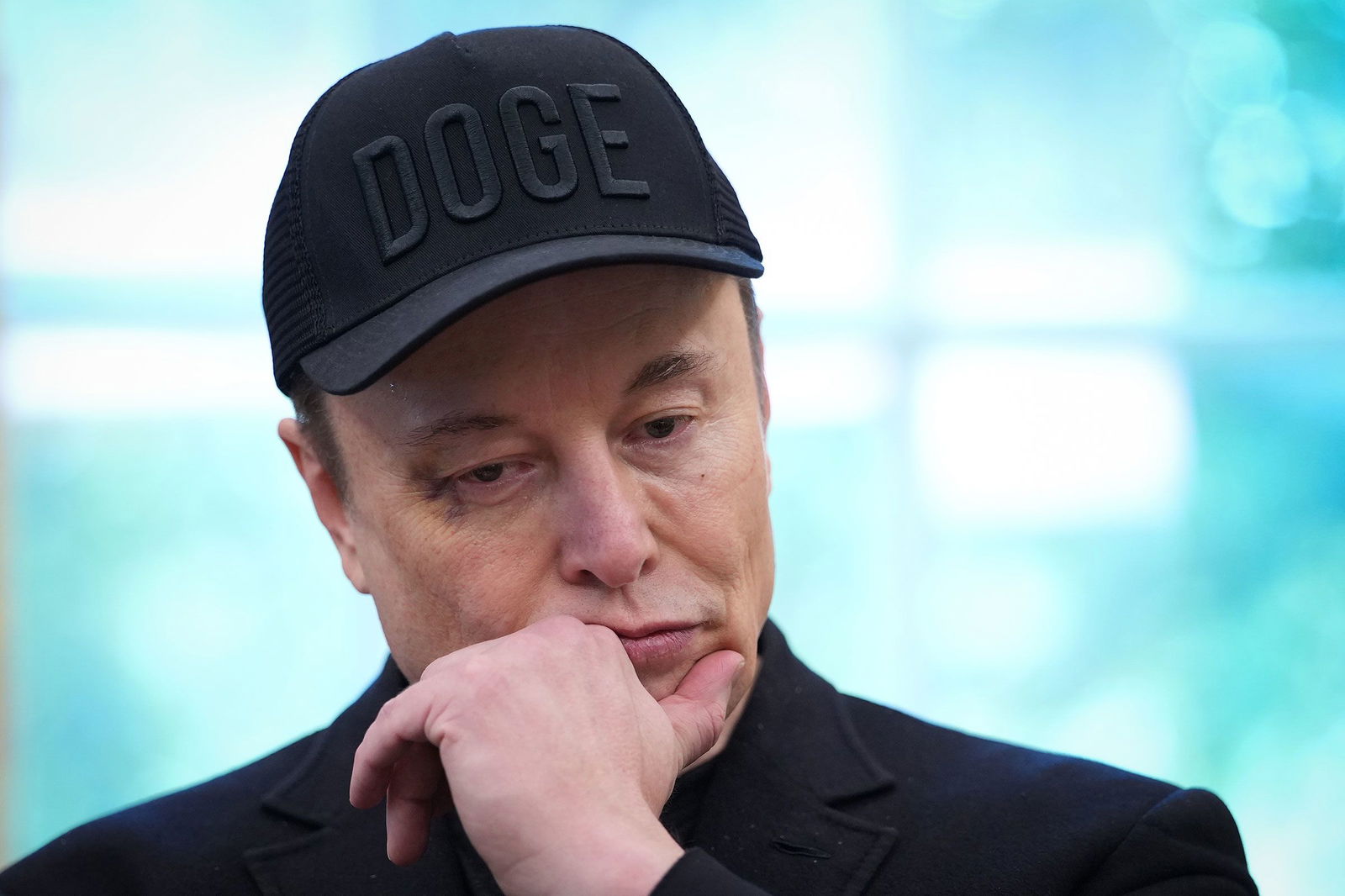 <i>Kevin Dietsch/Getty Images/File via CNN Newsource</i><br/>Elon Musk wears a DOGE hat in the Oval Office of the White House on May 30.