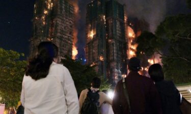 Victims are evacuated from the scene of a devastating fire which broke out at a karaoke bar in Hong Kong in January 1997.