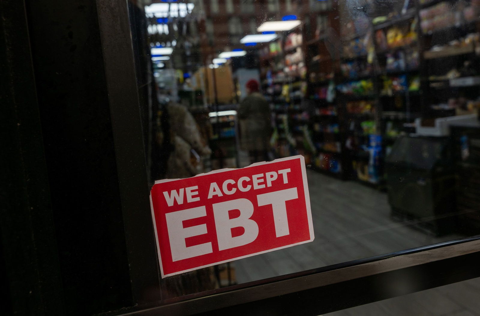 <i>Spencer Platt/Getty Images via CNN Newsource</i><br/>A store in New York displays a sign accepting Electronic Benefits Transfer cards for Supplemental Nutrition Assistance Program purchases for groceries on October 30
