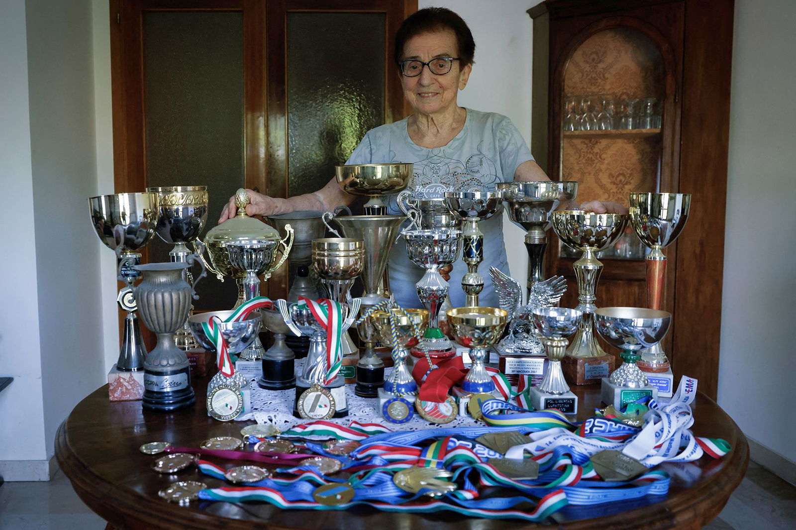 <i>Remo Casilli/Reuters via CNN Newsource</i><br/>Italian master runner Emma Maria Mazzenga poses for a picture with some of her trophies
